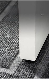 Close-up of slim gray striped door mat showing low profile clearance under a white door