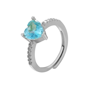 Macro shot of silver adjustable ring featuring a heart-shaped blue zircon and side stones