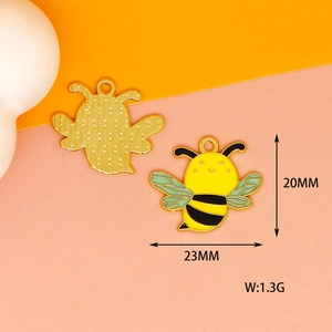 Detail view of bee enamel charm pendant with size dimensions 23mm by 20mm and weight 1.3g