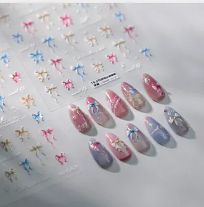Detailed view of 3D embossed ribbon bow nail stickers in pastel colors for manicures