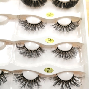 Detail view of 6D Russian volume lashes in 5D11 and 5D08 styles on a white tray