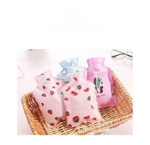 Mini PVC hot water bottles with cute strawberry and fruit patterns in a woven basket