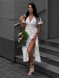 Detailed view of floral cotton dress with side slit and puff sleeves for summer style