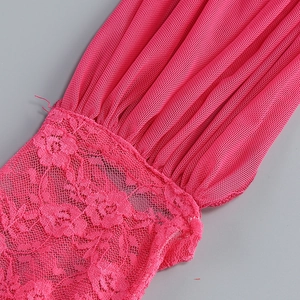 Detail view of rose red ribbed knit fabric stitched with delicate floral lace patterns