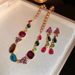 Vintage jewelry set with champagne pearl necklace and colorful rhinestone teardrop earrings