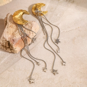 Elegant 18k gold plated moon stud earrings with silver star tassels on beige stone