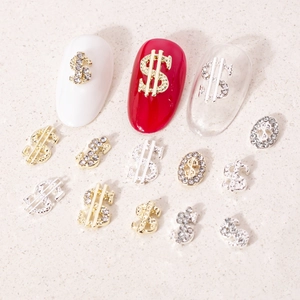 Luxury dollar sign nail art charms in gold and silver metal with sparkling rhinestones