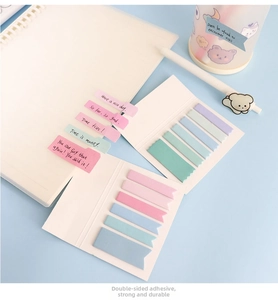 Macro shot of Morandi colored index sticky notes showing texture and pastel tones