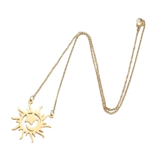 Golden long sweater chain with sun and crescent moon pendant on white background