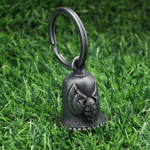 Macro detail of motorcycle guardian bell with skull and wings in stainless steel