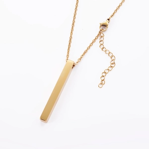 Macro shot of vertical gold plated bar pendant with adjustable lobster clasp chain