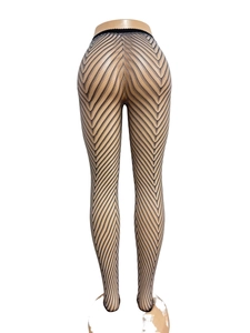 Detail shot of black hosiery featuring intricate chevron patterns and fine mesh texture