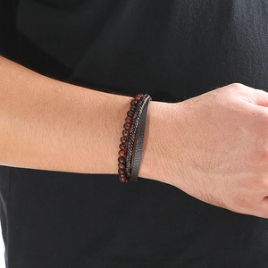 Close-up of multilayer leather and natural stone beads bracelet on a male wrist
