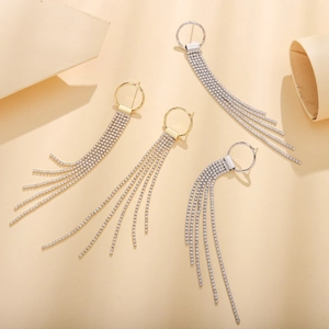 Elegant gold and silver hoop earrings with shimmering rhinestone tassels for brides