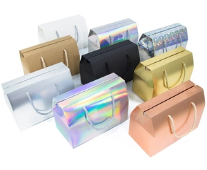 Selection of colorful paper gift boxes with rope handles and holographic finishes