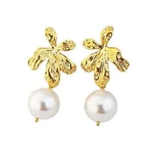 Elegant gold leaf earrings with round white pearls on a minimalist white background