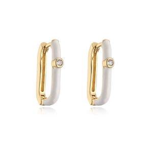 Detail of gold geometric earrings with white enamel and clear zircon stones