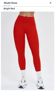 Detailed view of high-waist yoga leggings in bright red with body-shaping fit