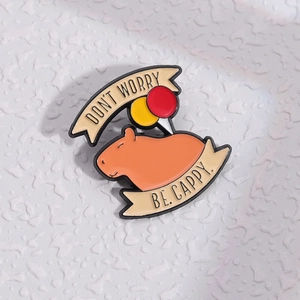 Cute capybara enamel pin with balloons and 'Don't Worry Be Cappy' slogan lettering