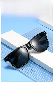 Classic black frame sunglasses with metal rivets on a geometric blue background