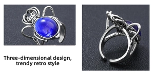 Macro shot of vintage silver beetle ring with oval blue gemstone and adjustable band