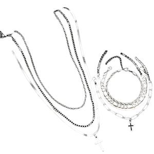 Silver multi-layer cross necklace and bracelet set featuring Cuban and snake chain styles