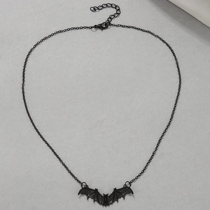 Detail of a black punk bat pendant necklace with adjustable chain and lobster clasp