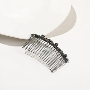 Close-up of gunmetal hair comb with 18 metal teeth and sparkling dark rhinestones