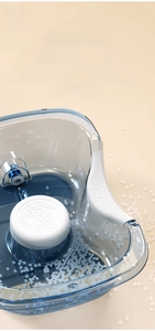 Detail view of transparent blue PET hair wash basin with ergonomic white neck support