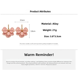 Detailed view of pink floral earrings with dimensions 3.8cmx3.5cm and silver pins