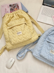 Quilted gingham drawstring backpack with front zip pocket for school and travel