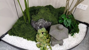 Zen indoor landscape set with artificial moss, stone lantern and white decorative pebbles