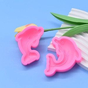 Pink silicone dolphin and whale cake mold set for ocean themed dessert decoration