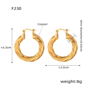 Detail view of twisted gold hoop earrings showing size 3.3cm height and 3.0cm width