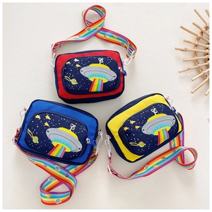 Three colorful UFO themed canvas crossbody bags for kids with rainbow shoulder straps detail