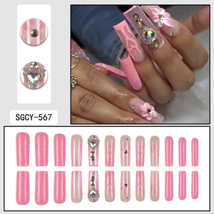 Pink heart coffin press-on nails with 3D flowers, rhinestones, and glitter finish