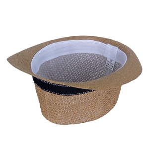 Detail of the 100% paper straw hat interior featuring a size 58 label and sweatband