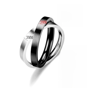 Detail of 3mm black matte and silver brushed titanium steel interlocking spinner rings