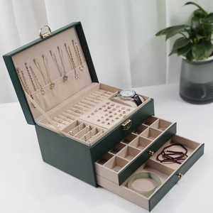 Three-layer dark green jewelry box with velvet interior and multi-grid storage