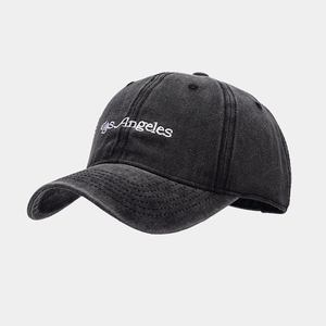 Detailed close-up of Los Angeles white embroidery on charcoal washed cotton baseball cap