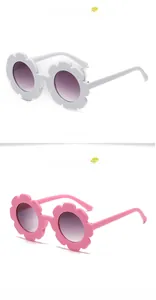 Detailed side view of flower shaped children sunglasses in matte white and pink colors