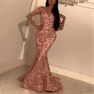 Detailed view of pink sequin embroidery on long sleeve mermaid evening gown
