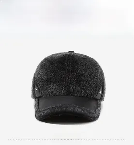 Detail of black faux fur winter baseball cap with leather brim and metal rivets