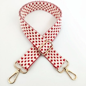 Adjustable woven shoulder strap for handbags with red and white geometric patterns