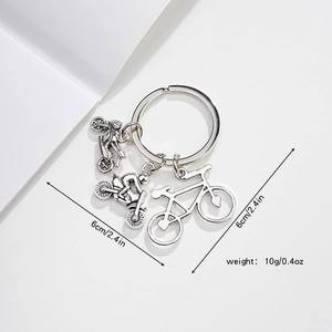 Silver metal keychain featuring detailed motorcycle and bicycle charms on a large ring