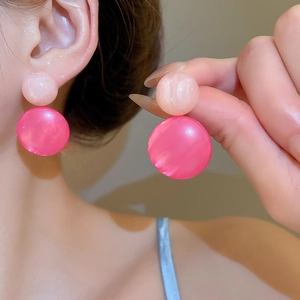 Detail of pink resin double circle earrings showing marble texture and gradient design
