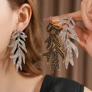 Vintage leaf tassel earrings with rhinestones in silver and black gold finishes