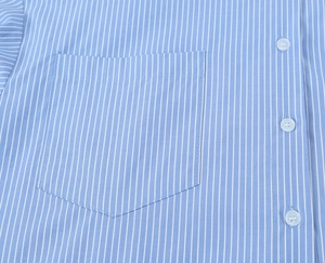 Detail of blue and white striped shirt with chest pocket and white buttons