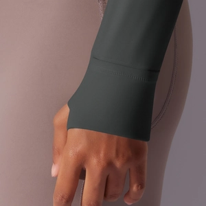 Close-up of charcoal gray athletic sleeve cuff with detailed stitching and matte fabric