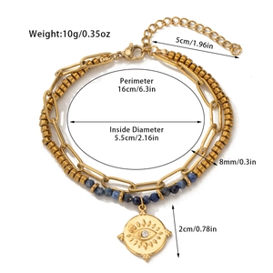 Detail view of double-layer gold titanium bracelet with blue natural stones and evil eye
